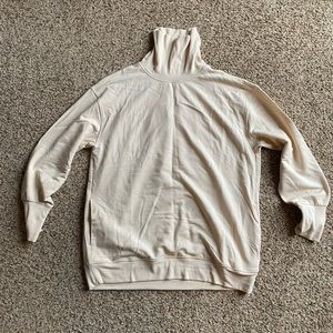 Athleta size medium turtleneck sweatshirt with cute detailing in back